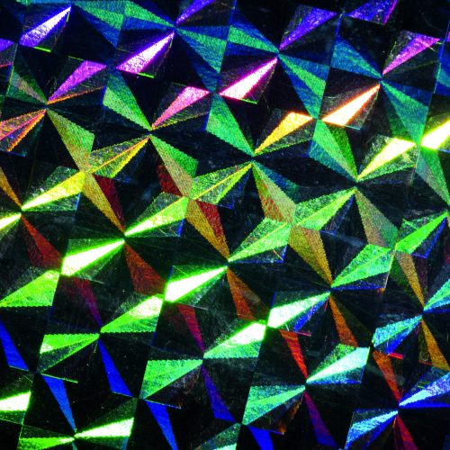 Psychedelic abstract formed by light reflecting off a textured metal surface